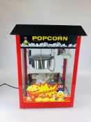 AN AS NEW POPCORN MACHINE BY ROYAL CATERING MODEL RCPS-16EB WITH INSTRUCTION MANUAL - SOLD AS SEEN.