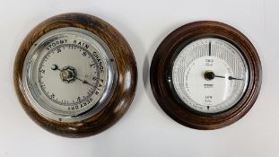 A VINTAGE OAK CASED BAROMETER ALONG WITH AN OAK CASED TIDE CLOCK.