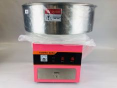 AN AS NEW COTTON CANDY MACHINE MODEL CCM-02 COMPLETE WITH INSTRUCTIONS. - SOLD AS SEEN.