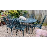 A DECORATIVE CAST ALUMINIUM GREEN FINISH GARDEN TABLE AND SIX CHAIRS.