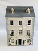 A LARGE GEORGIAN STYLE THREE STORY DOLLS HOUSE COMPLETE WITH FURNISHINGS AND FITTINGS W 59CM.