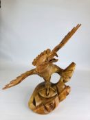 A LARGE CARVED HARDWOOD EAGLE H 60CM X W 49CM X D 33CM.