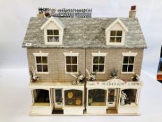 A LARGE VICTORIAN STYLE DOLLS HOUSE WITH BAKERY AND FLORIST SHOPS TO GROUND FLOOR COMPLETE WITH