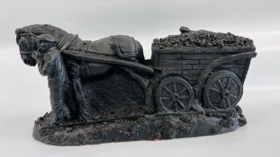 A HAND CRAFTED "MINING MEMORIES" SCULPTURE MADE FROM DEEP MINED COAL.