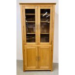 A MODERN LIGHT OAK GLAZED CABINET WITH SHELVED INTERIOR AND CUPBOARD TO BASE. W 93CM. D 36CM.
