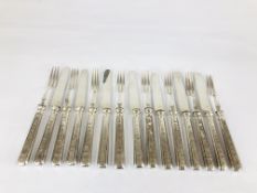 A SET OF TWELVE FRENCH WHITE METAL TEA KNIVES AND FORKS, 20CM LONG.