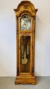 AN IMPRESSIVE OAK CASED GRANDFATHER CLOCK MARKED "HOWARD MILLER" ALONG WITH INSTRUCTION MANUAL.