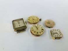 A GROUP OF FOUR VINTAGE WATCH FACE MOVEMENTS MARKED "OMEGA" AND A FURTHER VINTAGE EXAMPLE MARKED