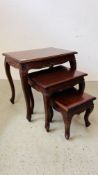 A NEST OF 3 HARDWOOD CARVED OCCASIONAL TABLES BEARING MAKERS LABEL "CACHET".