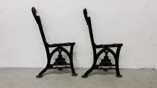A PAIR OF CAST IRON BENCH ENDS MARKED "C.M. HAMMER LONDON.