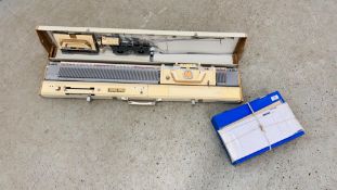 A BROTHERS KM-830 KNITTING MACHINE ALONG WITH PATTERNS AND INSTRUCTIONS - SOLD AS SEEN.