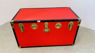 A LARGE RED METAL BOUND TRUNK, W 93CM X D 51CM X H 50CM, COMPLETE WITH KEYS.