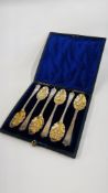A CASED SET OF 6 ANTIQUE SILVER GILT BERRY SPOONS IN FITTED VELVET LINED CASE (A/F).