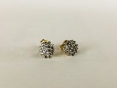 A PAIR OF 9CT GOLD AND DIAMOND EARRINGS.