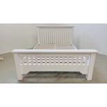 A MODERN WHITE FINISH DOUBLE BEDSTEAD.
