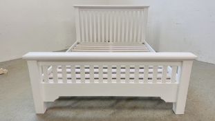 A MODERN WHITE FINISH DOUBLE BEDSTEAD.