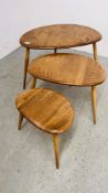 A NEST OF THREE ERCOL KIDNEY SHAPED OCCASIONAL TABLES.