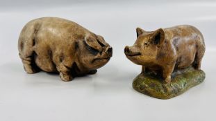 TWO PIG SCULPTURES, ONE BEARING AN ERIC HERON MAKERS LABEL.