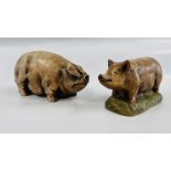 TWO PIG SCULPTURES, ONE BEARING AN ERIC HERON MAKERS LABEL.