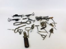 A COLLECTION OF VINTAGE CORKSCREWS AND BOTTLE OPENERS ALONG WITH SUGAR BLOCK NIPS AND 5 CANDLE