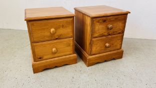 A PAIR OF MODERN HONEY PINE 2 DRAWER BEDSIDE CHESTS.