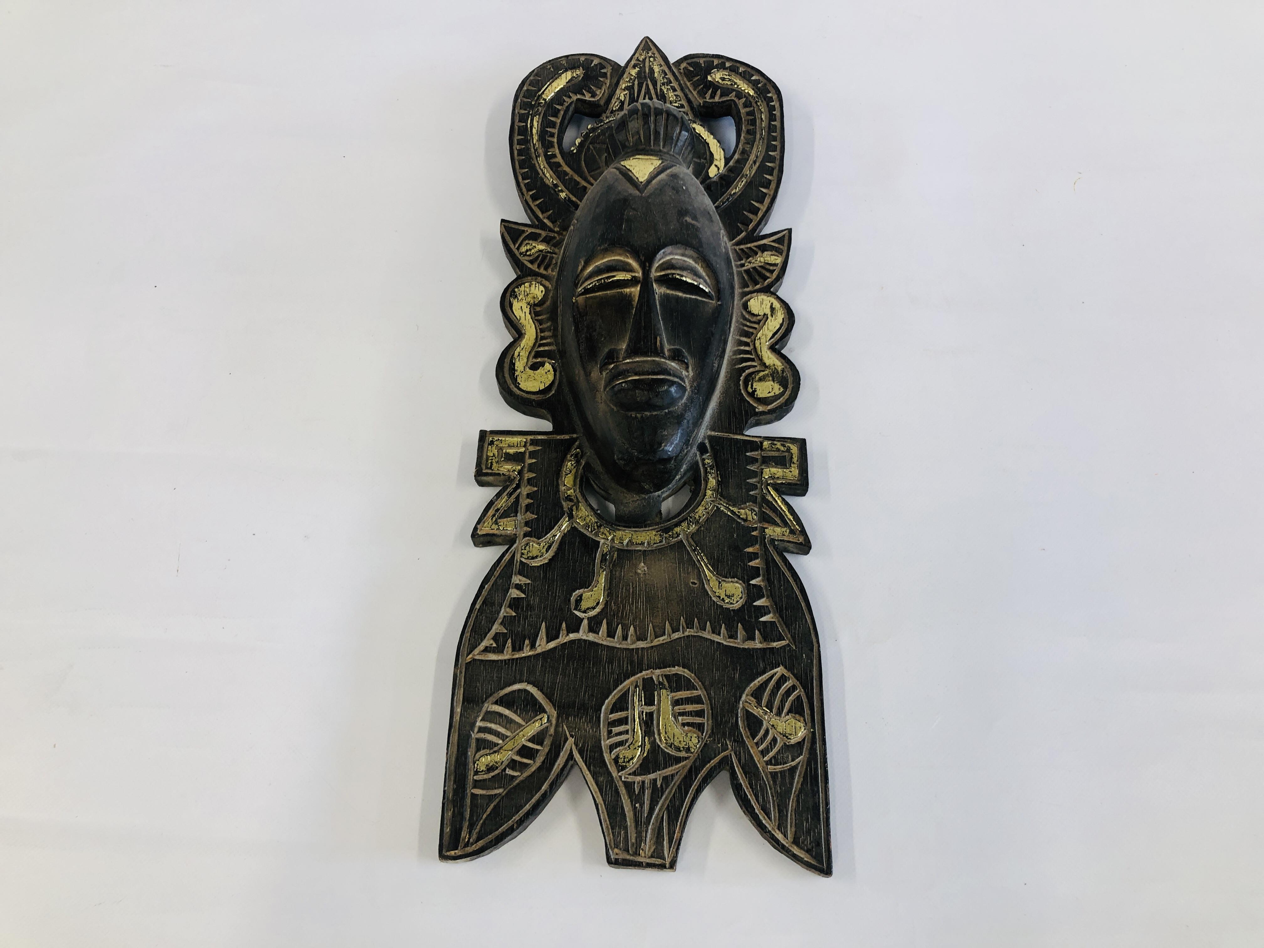 A WOODEN ETHNIC WALL HANGING MASK. H 59CM.