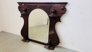 A DECORATIVE HARDWOOD AND CARVED OVER MANTEL MIRROR, WIDTH 135CM.