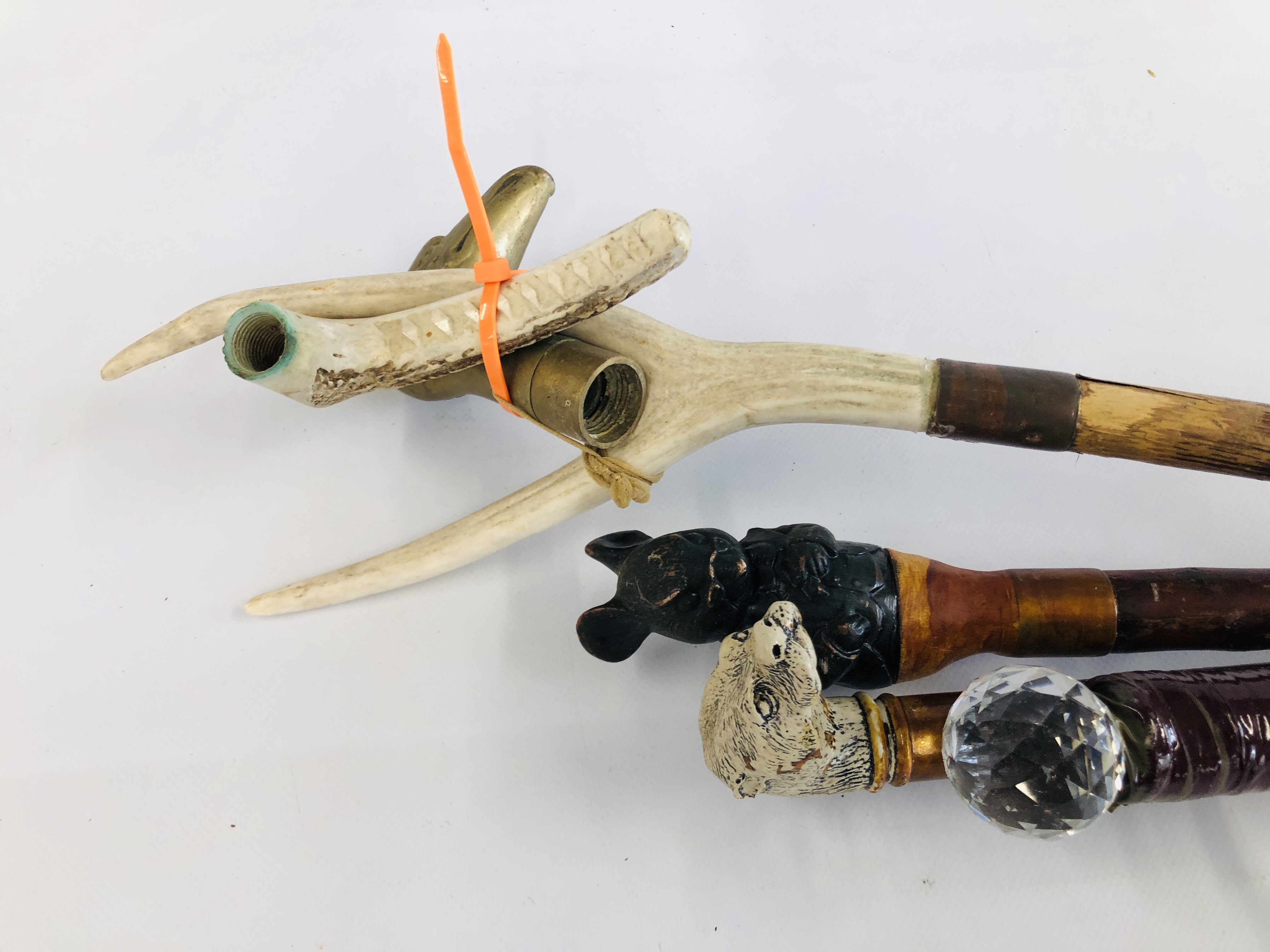 A GROUP OF 4 WALKING STICKS, ONE HAVING MOUSE TOP, HORN HANDLES AND OTHER HEAD ETC.