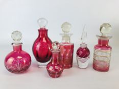 A GROUP OF 6 VARIOUS CRANBERRY GLASS DECANTERS AND PERFUME BOTTLES.