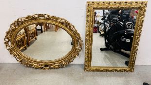 AN ORNATE GILT FRAMED REPRODUCTION OVAL WALL MIRROR - HEIGHT 91CM ALONG WITH A REPRODUCTION GILT