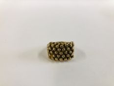 A 9CT GOLD KEEPER RING.