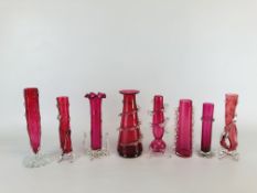 A COLLECTION OF 8 VINTAGE CRANBERRY GLASS VASES OF VARIOUS DESIGNS AND SIZES.