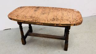 AN ARTS AND CRAFTS STYLE OAK BASED OCCASIONAL TABLE WITH HAMMERED COPPER TOP AND STUD DETAIL.