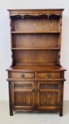 AN OLD CHARM OAK DRESSER, TWO DOOR, TWO DRAWER CUPBOARD BASE.