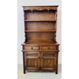 AN OLD CHARM OAK DRESSER, TWO DOOR, TWO DRAWER CUPBOARD BASE.