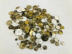 A TIN CONTAINING AN EXTENSIVE QUANTITY OF ASSORTED VINTAGE WATCH / POCKET WATCH MOVEMENTS AND