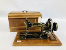 A VINTAGE GILT DECORATED FRISTER & ROSSMANN SEWING MACHINE COMPLETE WITH COVER - SOLD AS SEEN.