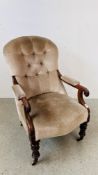 A VICTORIAN SCROLL ARM EASY CHAIR, TURNED FORELEGS TERMINATING IN BRASS CASTERS,