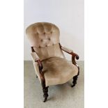 A VICTORIAN SCROLL ARM EASY CHAIR, TURNED FORELEGS TERMINATING IN BRASS CASTERS,
