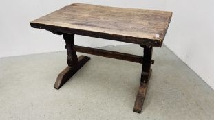 A RUSTIC PINE TRESTLE STYLE DINING TABLE.