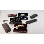 FOUR PAIRS OF SPECTACLES 1930'S IN CASES, THREE SPECTACLE CASES WITH WHITE METAL CHAIN.