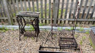 A VINTAGE CAST METAL SINGER SWING MACHINE BASE, CAST METAL FIRE GRATE IRON WORK STAND,