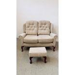 A "HSL" BEIGE UPHOLSTERED TWO SEATER HIGH BACK SOFA AND MATCHING FOOTSTOOL, W 140CM,