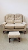 A "HSL" BEIGE UPHOLSTERED TWO SEATER HIGH BACK SOFA AND MATCHING FOOTSTOOL, W 140CM,