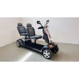 A KYMCO TANDUM MOBILITY SCOOTER COMPLETE WITH CHARGER AND KEY - SOLD AS SEEN.