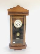 A MAHOGANY CASED WALL CLOCK WITH ENAMELLED DIAL. H 83CM.