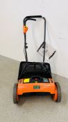A VICTOR GARDEN TOOLS 24 VOLT RECHARGEABLE CYLINDER MOWER COMPLETE WITH CHARGER AND MANUAL.