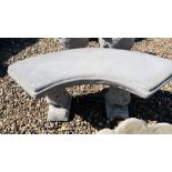 A STONEWORK GARDEN SEAT, THE CURVED TOP SUPPORTED BY SQUIRRELS, LENGTH 100CM.