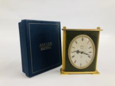 A TRAVELLING CLOCK BY JAEGER RECITAL IN ORIGINAL BOX.