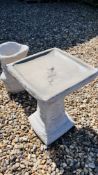 A SQUARE STONEWORK GARDEN BIRD BATH WITH RELIEF ROSE DECORATION, HEIGHT 52CM.